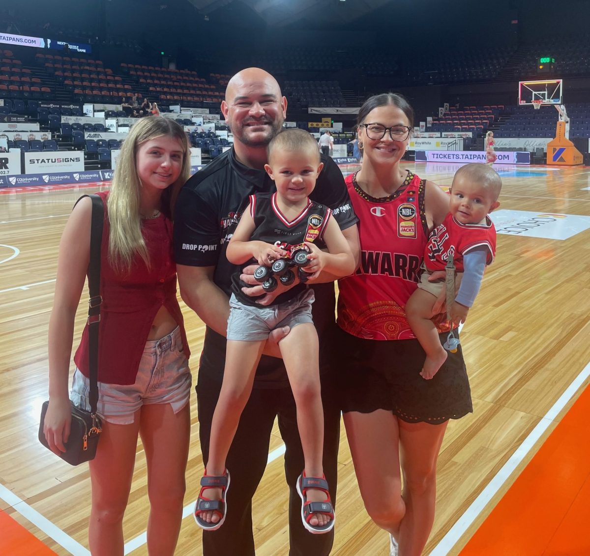 Family on basketball court