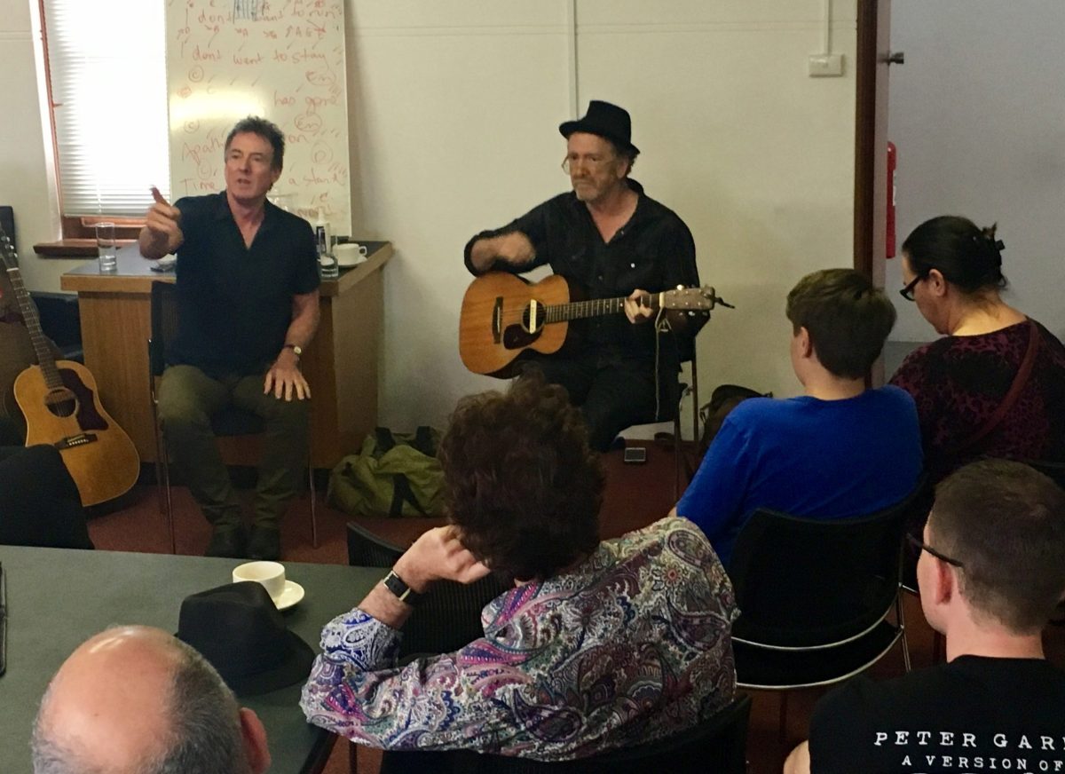 Two guys one with guitar