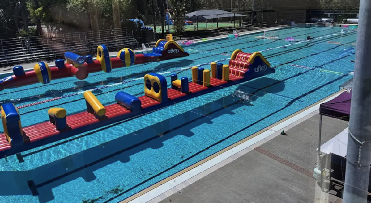 Inflatable obstacle course in a pool