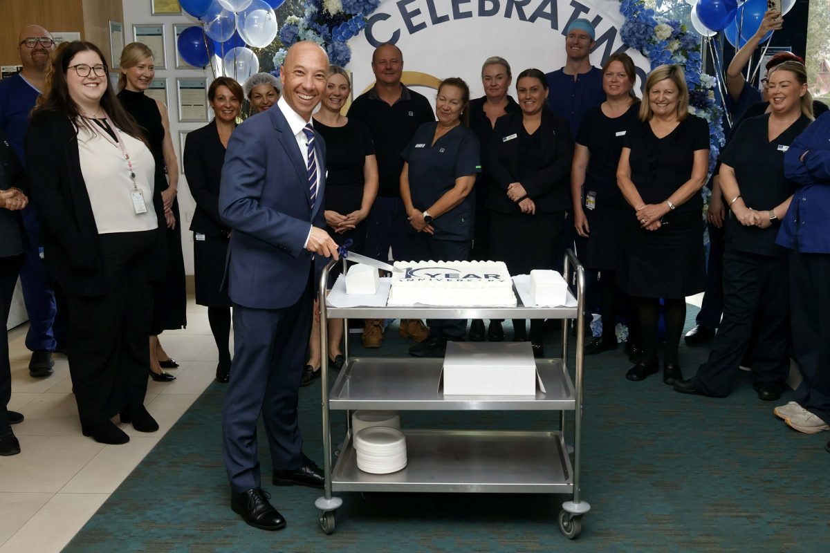 Steve Rajcany cutting cake