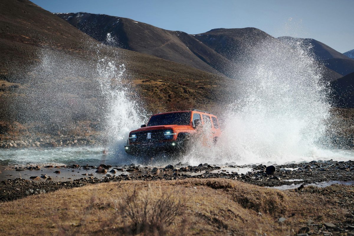 4WD splashing through a stream