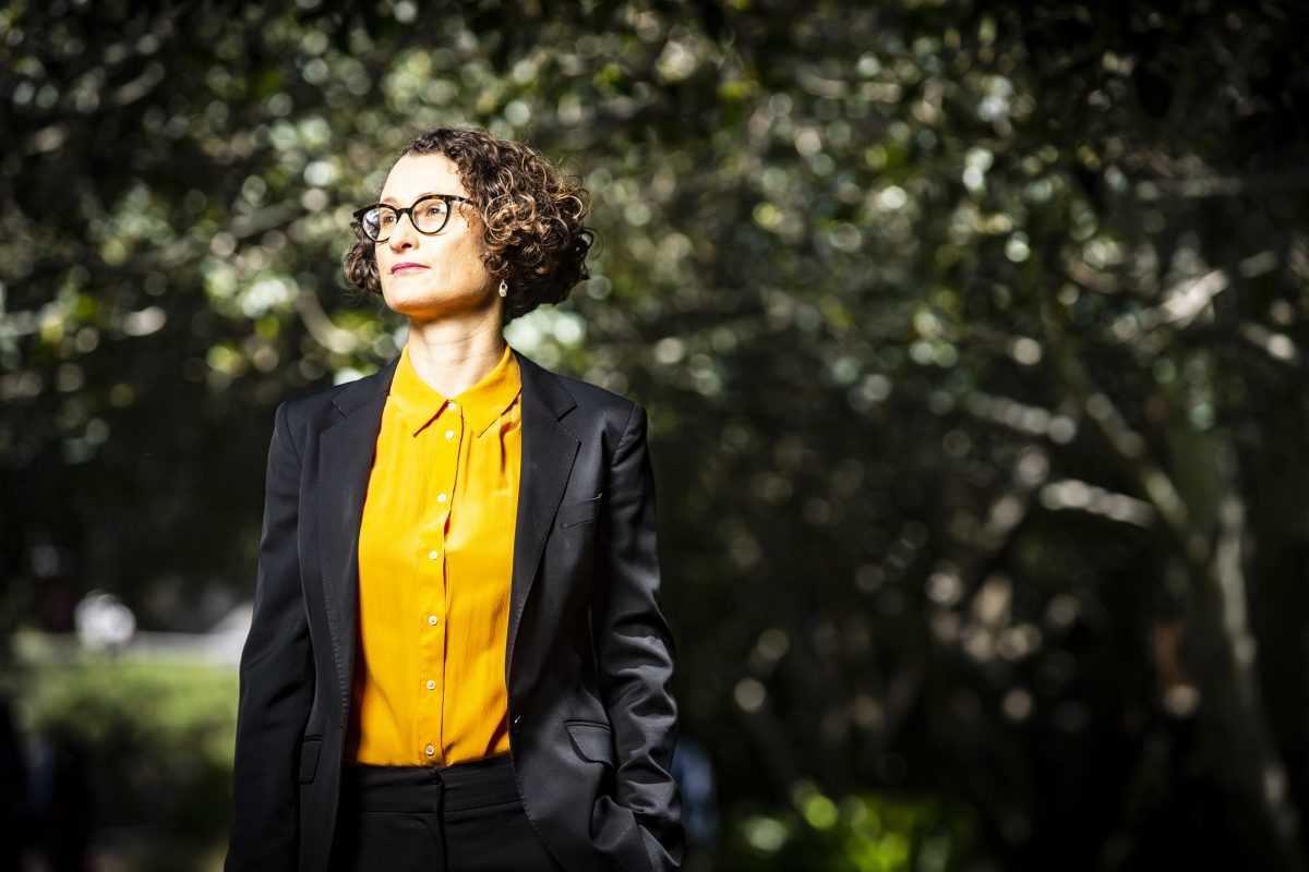 woman standing near trees