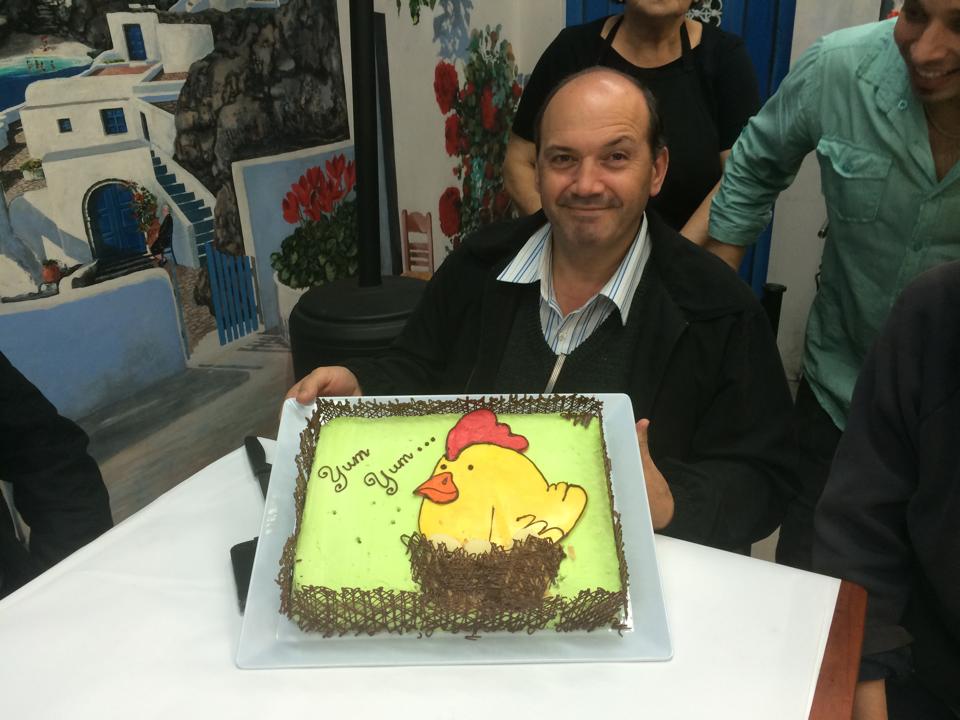 Tony Gregoriou with a cake