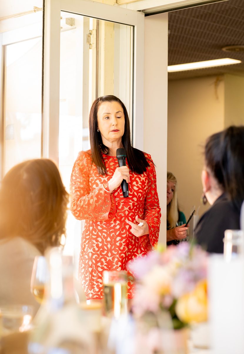 Woman in red dress with microphone